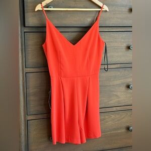 Bebe Red  NWT one piece shorts outfit lace black back . Size XS